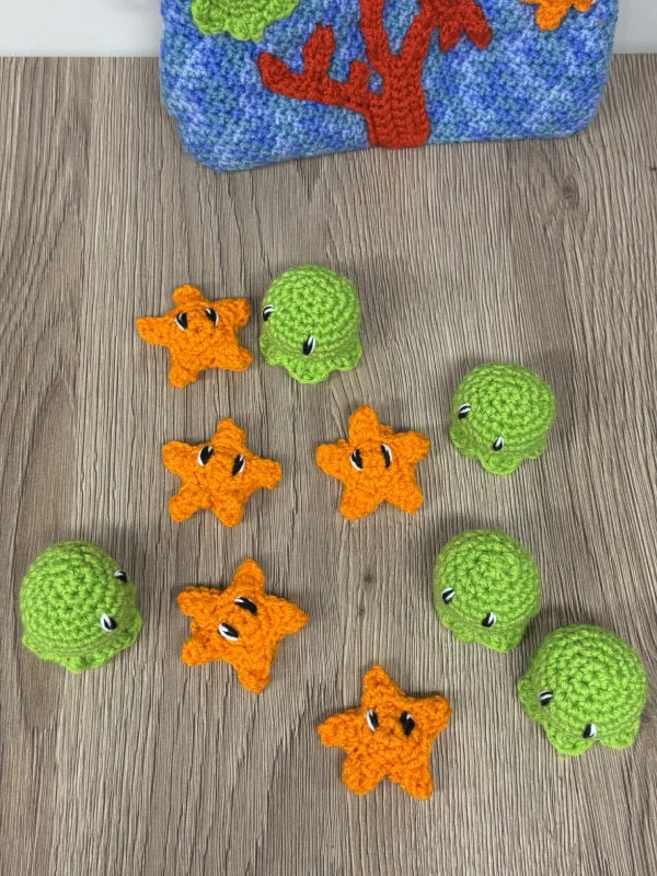 Pieuvre au crochet : pourquoi ce motif fait main a autant de succès 4 pochette en crochet fait main avec pieuvre et étoile, thème fond marin